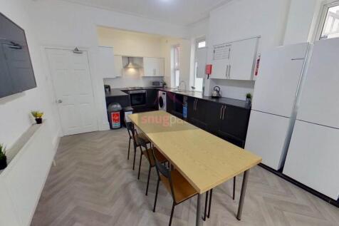 Modern kitchen with ample counter space, bright...