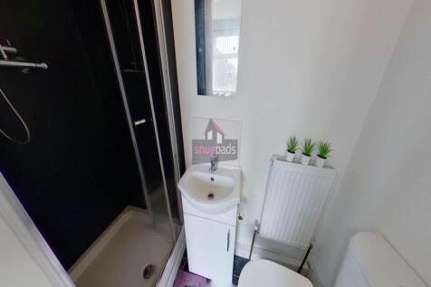 A clean and well-maintained bathroom featuring ...