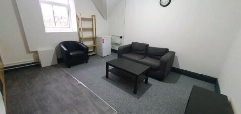 A cozy and well-maintained living area featurin...