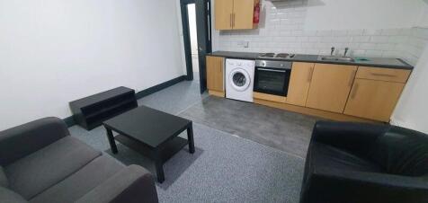 A modern kitchen area equipped with essential a...