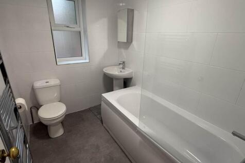 A modern, well-maintained bathroom featuring a ...