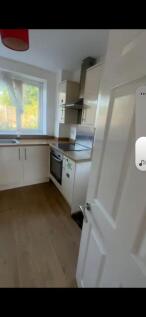 Bright and functional kitchen with a large wind...