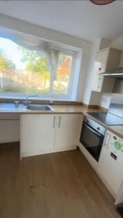 A bright and functional kitchen with a large wi...