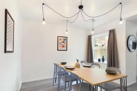 Bright and spacious living room with modern dec...