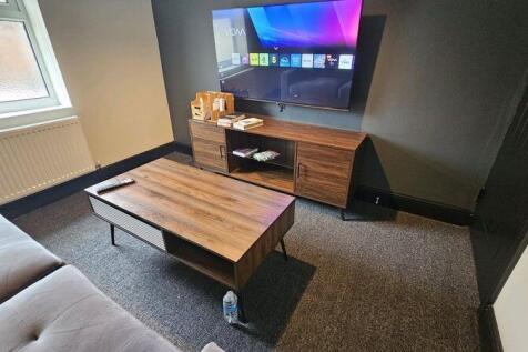 Modern and comfortable living room featuring a ...