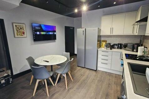 Modern and well-maintained kitchen featuring sl...