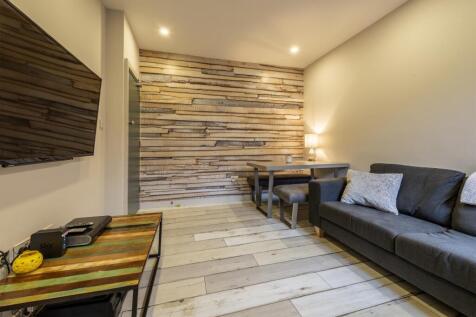 Contemporary living room with a textured timber...