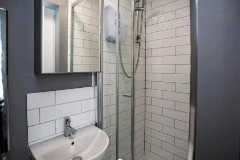 A modern and clean bathroom featuring a compact...
