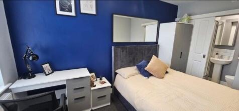 A modern double bedroom featuring a comfortable...