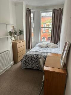 A cozy bedroom with a comfortable double bed, t...