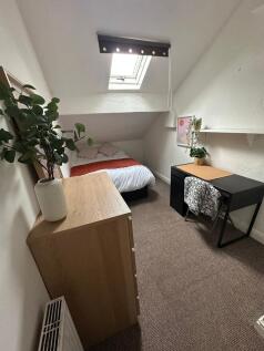 Cozy and well-maintained bedroom with a comfort...