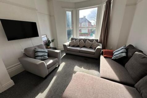 Bright and inviting living room featuring multi...