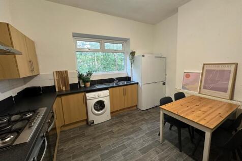 Bright and functional kitchen featuring wooden ...