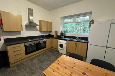 A bright and well-maintained kitchen with moder...