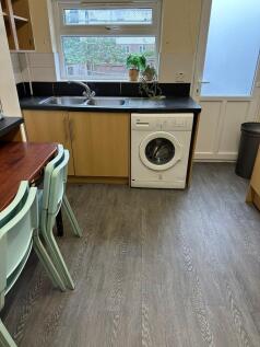 Bright and functional kitchen with a modern bla...