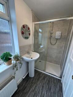 Bright and clean bathroom with a shower cubicle...