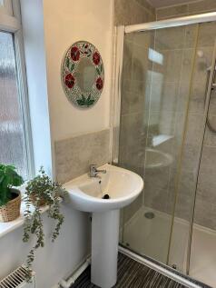 A clean and well-maintained bathroom featuring ...