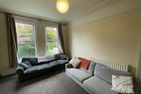 Bright and inviting living room featuring two l...