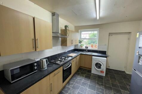 Modern and functional kitchen area with wooden ...
