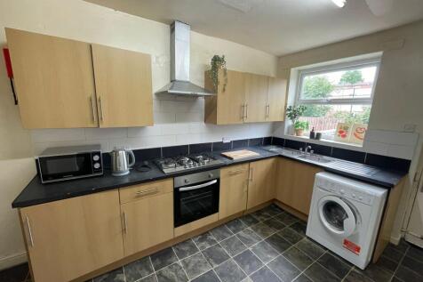 A modern, well-maintained kitchen featuring woo...