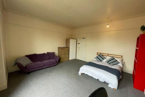 Spacious and inviting living area featuring a c...