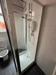 A clean and functional bathroom with a compact ...