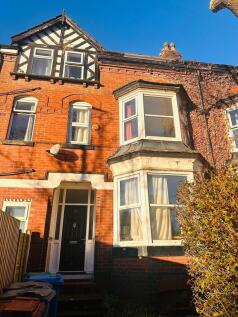 The front view of a charming brick house featur...