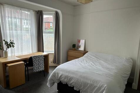 Bright and inviting double bedroom featuring a ...