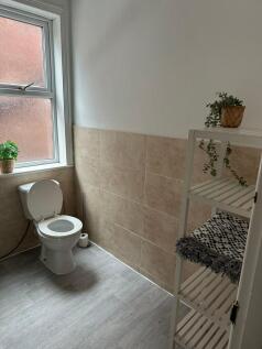 Bright and clean bathroom featuring a modern to...