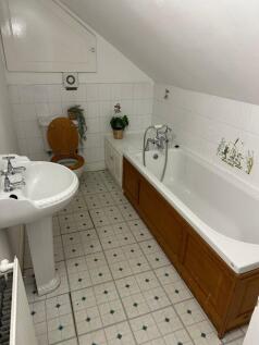 A clean, well-maintained bathroom featuring a b...