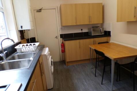 A modern, well-maintained kitchen with wooden c...