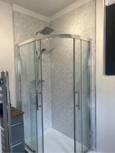 A modern and clean bathroom featuring a stylish...