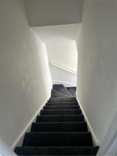 A well-maintained staircase leading to the uppe...