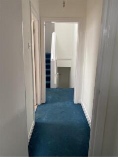 A spacious and clean hallway leading to various...