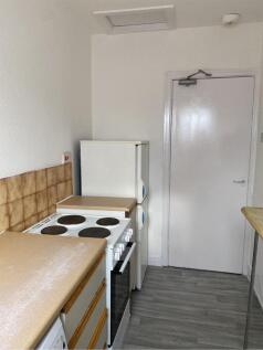 A tidy kitchenette featuring essential applianc...