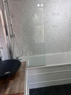 A bright and modern bathroom featuring a sleek ...