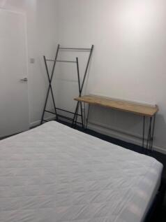 A spacious double bedroom with potential for pe...