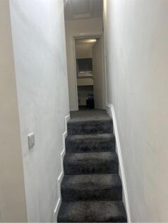 A well-maintained staircase leading to the uppe...