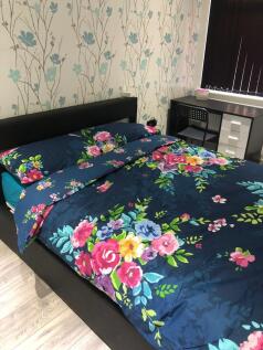 A vibrant and inviting double bedroom featuring...