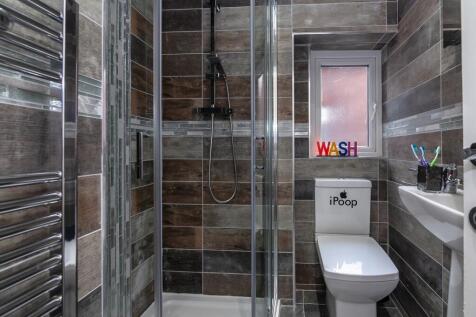 A modern and stylish bathroom featuring a sleek...