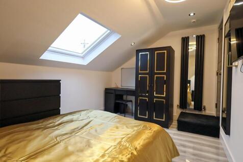 A stylish and well-lit double bedroom featuring...