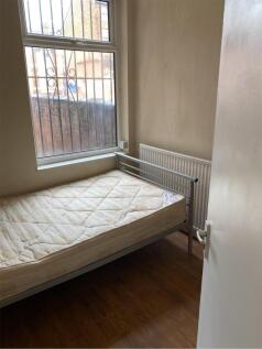 A cozy single bedroom with good natural light, ...