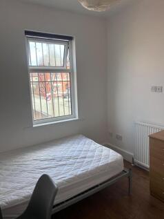 A cozy room with a bed and a view, perfect for ...