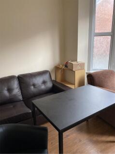 A cozy living room with ample seating and good ...