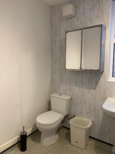 A tidy bathroom featuring essential amenities, ...