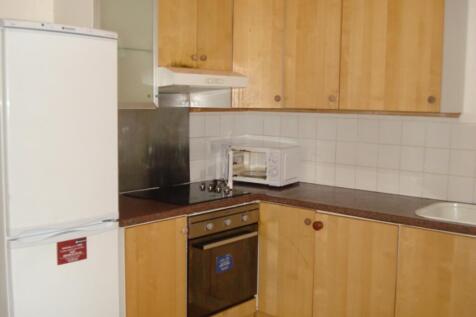 A functional kitchen equipped with essential ap...