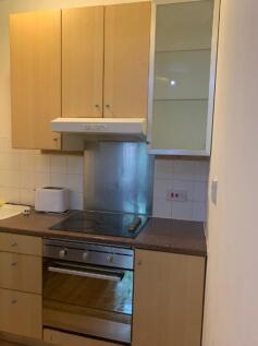 A tidy kitchen with essential appliances, perfe...