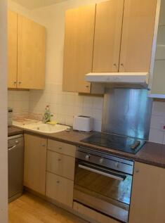A bright and functional kitchen equipped with e...