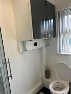 A clean and functional bathroom featuring a toi...