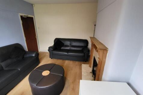 A modern living room featuring spacious seating...